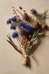 Autumn's bounty unfolds in a meticulously arranged posy, where Blue Cornflowers intermingle with dried artichokes and sprigs, tied by rough twine