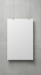 Stunning photo of empty white vertical rectangle poster mockup with soft shadows on neutral light grey concrete wall background. Flat lay, top view.