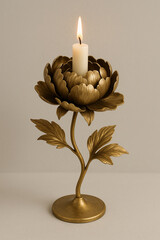 Elegant Gold Flower Candle Holder with Lit White Candle on Neutral Background
