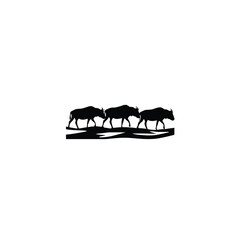 A herd of wildebeest crossing a river silhouette on white background