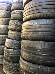 Old worn-out tires for cars. It is assembled for recycling.