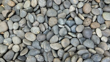 Pebble pattern of colored stones. Abstract natural pebble background