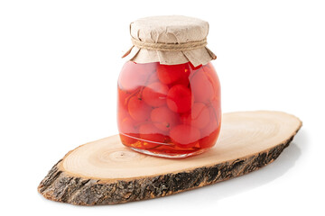 Jar of Preserved Cherries with Craft Paper Lid on Wooden Stand, Isolated on White