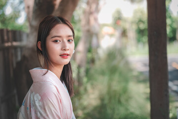 Young Woman in Traditional Attire Posing Outdoors in Natural Light