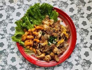 Delicious Stir-Fried Noodles with Chicken and Fresh Greens on Plate