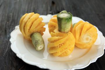 Peeled Small Pineapple Or Nanas Madu on White Plate