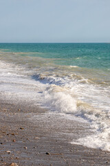 The ocean is calm and the waves are small