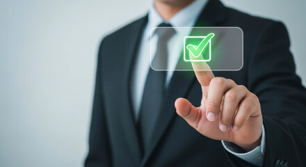 Businessman Hand Touching Checkmark Icon on Digital Screen in Black Suit