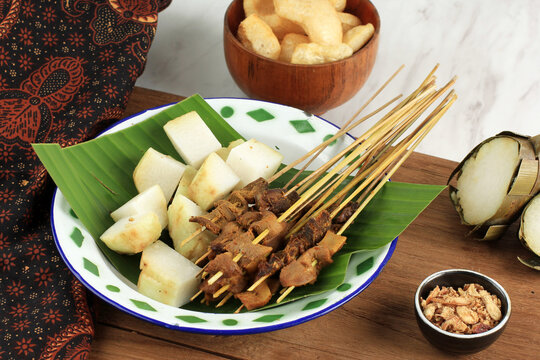Sate Padang, Spicy Beef Satay with Spicy Curry Brown Sauce from Padang, West Sumatra.