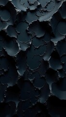 Intricate black surface with varied texture and depth, deep, art