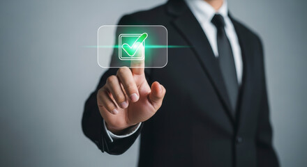 Businessman Touching Digital Button with Checkmark in Black Suit