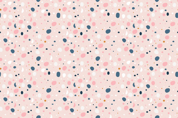 Beautiful seamless pattern with colorful uneven polka dots on  delicate pink background. Abstract spots. For backgrounds, wallpapers, textiles, packaging, or  website.