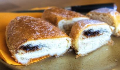 tasting chocolate donuts on a plate