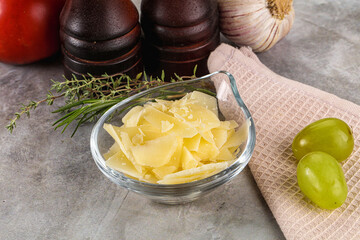 Parmesan cheese slices in the bowl
