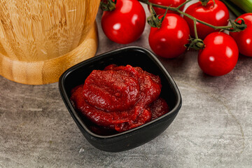 Red tomato paste in the bowl