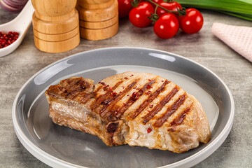 Grilled pork loin steak with bone