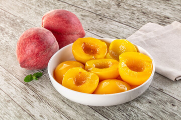 Sweet ripe yellow canned peaches