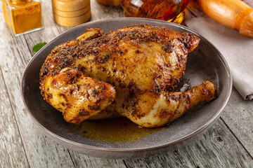 Baked in oven whole chicken with spices