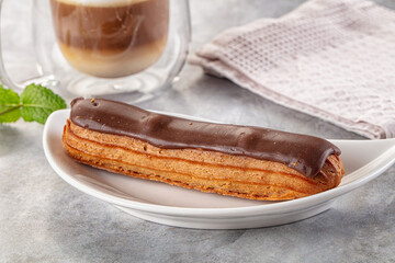 Gourmet chocolate eclair with icing