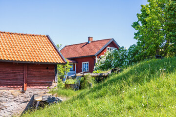 Old water mill with a red cottage in the swedish countryside
