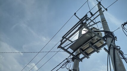 electric transformer with sky background