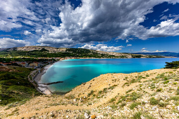 Hiking trail leading from the beach in Baska to the Bag mountain, city panorama seen from above,