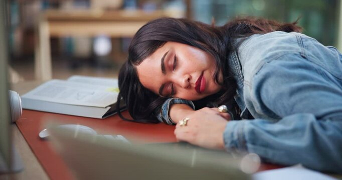 University student, tired and girl with sleeping in library for learning fatigue, burnout and stress. Education, rest and person with nap at college for exam study, low energy and academic exhaustion - Powered by Adobe