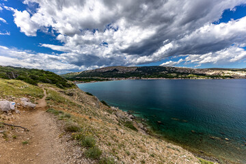 A walk along the rocky road from the beach in Baska to the top of Mount Bag,