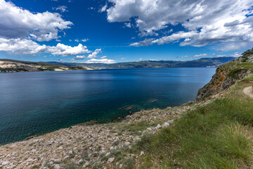 A walk along the rocky road from the beach in Baska to the top of Mount Bag,