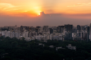 Fototapeta premium Sunset Sky Over Dhaka Cityscape with Buildings