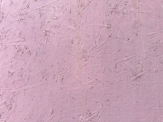 Pink paint cracks on wood surface. texture of painted pressed wood