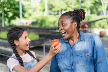 Happy black farmer mother and daughter on vegetable farm for agriculture, business growth and...