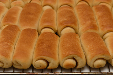 Freshly Baked Parker House Rolls on Kitchen Countertop Cooling