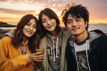group of friends having fun at the beach, group of happy people, A group of young friends took selfies at the beach, fashion style, holding beer glasses at sunset on the beach.