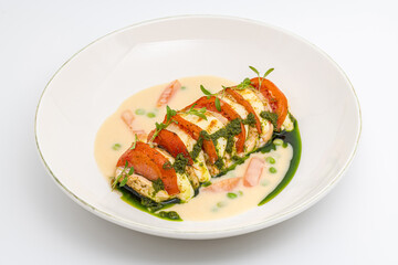 Stuffed chicken breast with tomato, mozzarella, cream and herb sauce