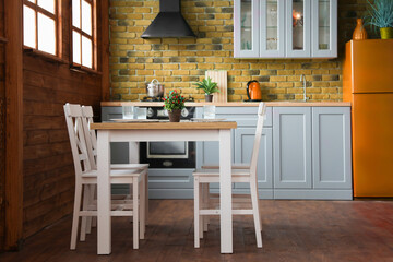 Dining table and chairs in kitchen. Interior design
