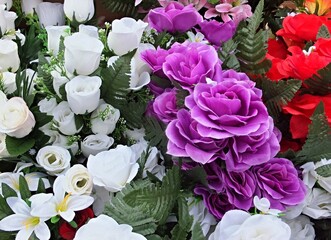 Colorful artificial flowers creating a vibrant and diverse floral arrangement