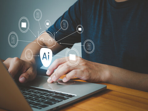 A person using laptop with artificial intelligence icons floating, symbolizing ai technology and digital data management in modern workspace