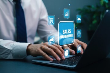 Person using a laptop with sales performance interface.