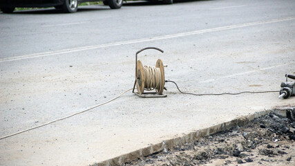 small coil with wires on the blocked road