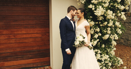 Wedding, celebration and couple with hug outdoor for marriage ceremony, milestone and romance. Relationship, happy people and event by home with commitment, promise and union of love with partnership