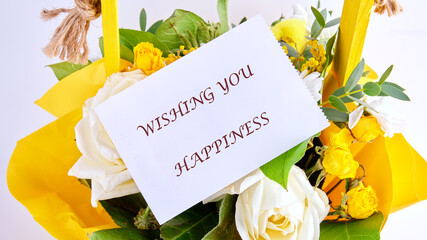 The conceptual phrase WISHING YOU HAPPINESS. The concept of good mood and pastime