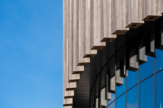 Curved architectural detail with wood texture and shadow, clean background for urban architecture and modern design themes in commercial business visuals