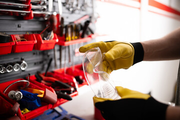 Mechanic Holding A Protective Googles In Hand