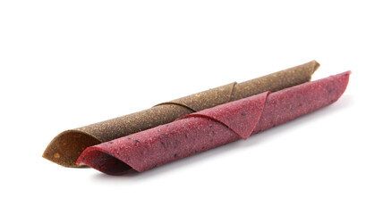 Delicious fruit leather rolls on white background