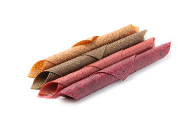 Delicious fruit leather rolls on white background