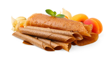 Delicious fruit leather rolls, mint, apricots and physalis isolated on white
