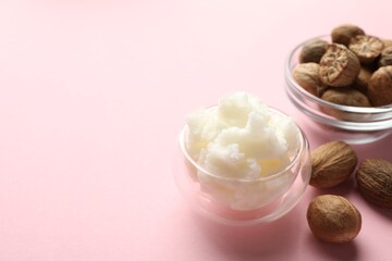 Natural shea butter on pink background, closeup. Space for text