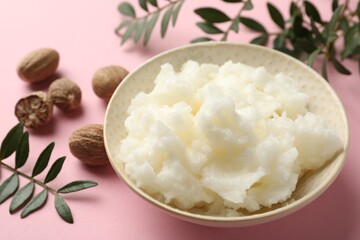 Natural shea butter on pink background, closeup