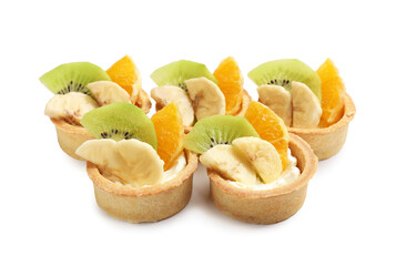 Tartlets with fruits isolated on white. Delicious dessert